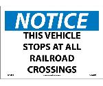 NOTICE THIS VEHICLE STOPS AT ALL RAILROAD CROSSINGS SIGN
